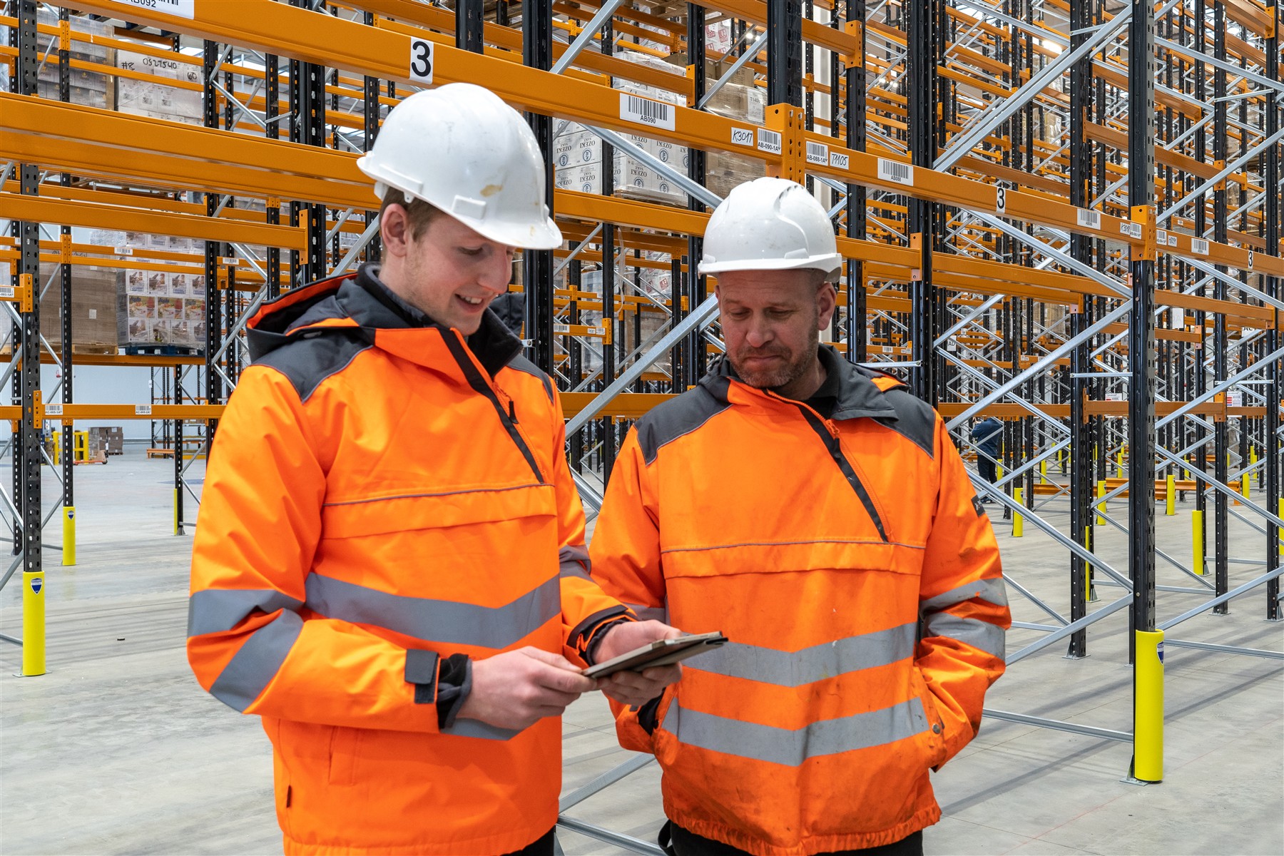 Construction professionals reviewing information within a warehouse
