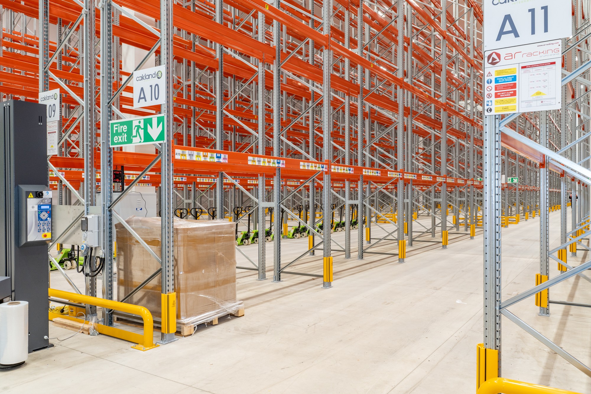 High-bay warehouse with orange storage racking